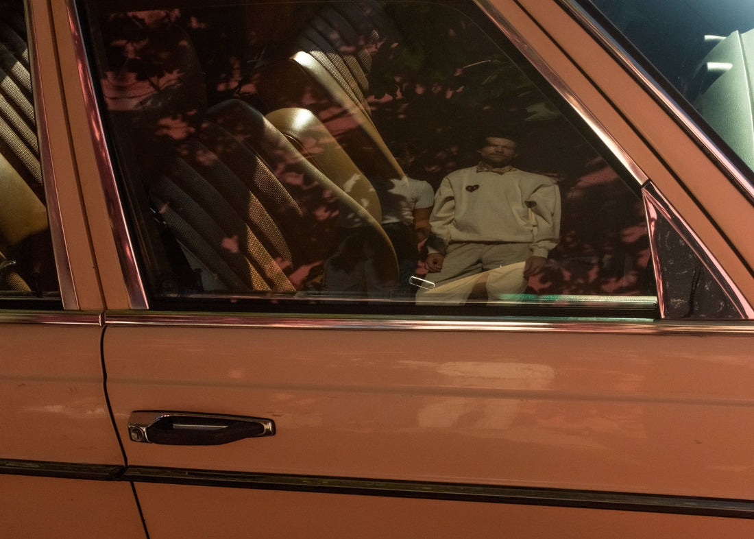 Reflection of person in a car window