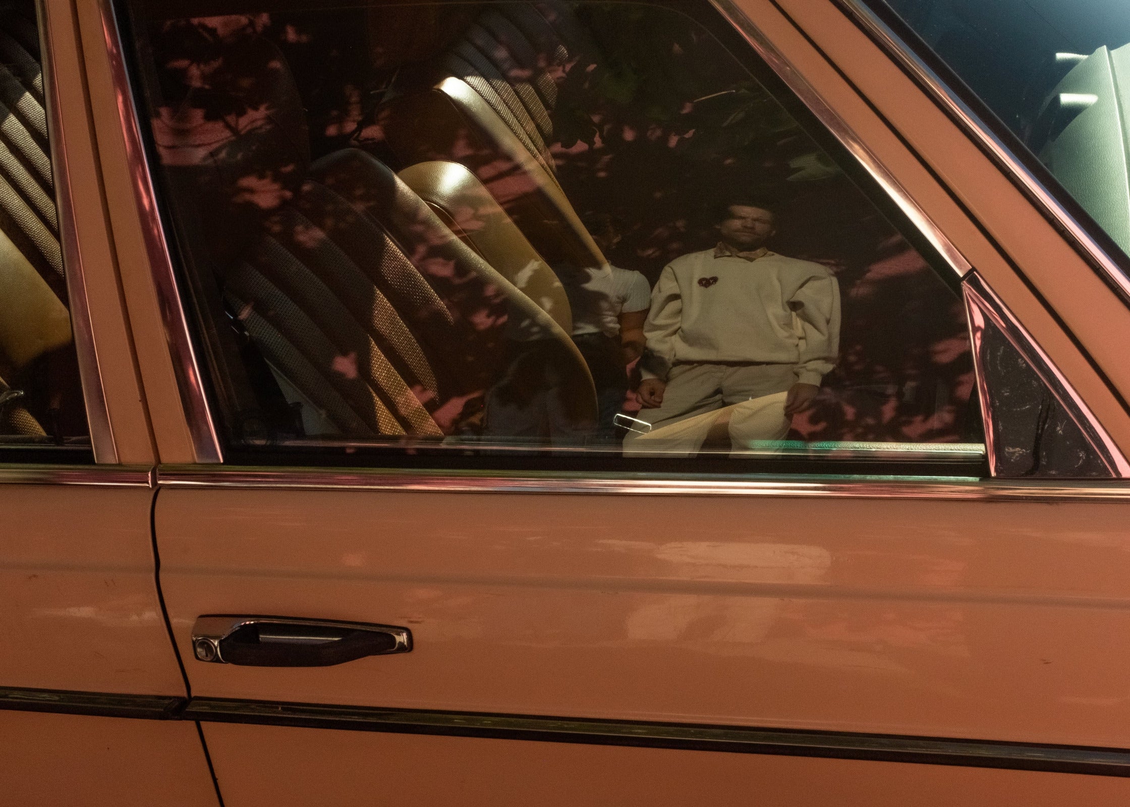 Reflection of person in a car window